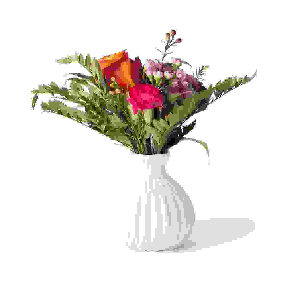 White flower vase with cherry red flower